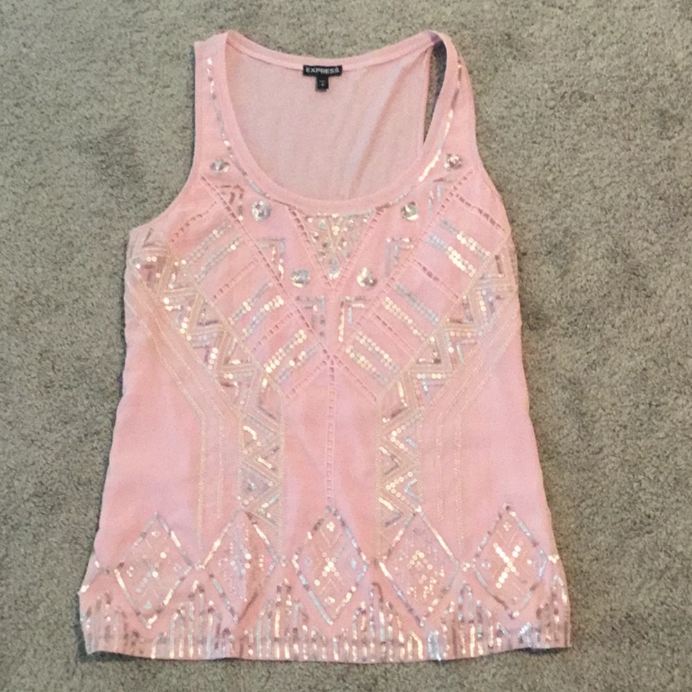 A pink tank top with a sequence design